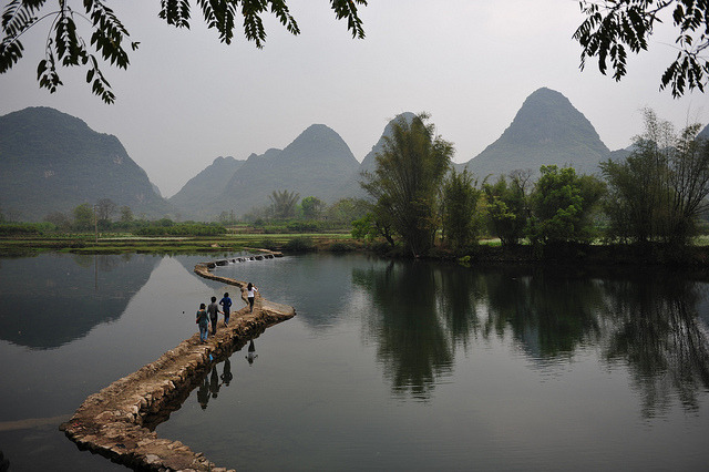 Walking on the river, Yangshuo, China