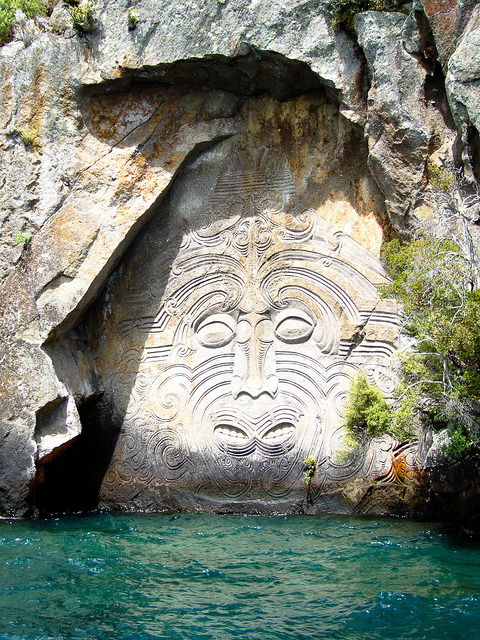 visitheworld:Maori rock carvings at Mine Bay on Lake Taupo, New Zealand