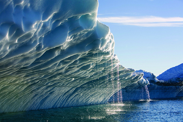 Melting water streams from iceberg calved from Ilulissat Kangerlua Glacier in Disko Bay, Greenland