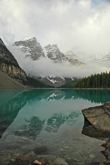 Magic of morning fog in the Valley of Ten Peaks at Moraine Lake, Canada
