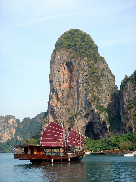 Traditional junk boat anchored in front of Phra Nang beach, Krabi, Thailand