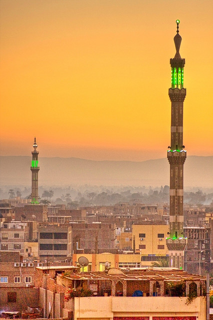Sunset on the cityscape and the minarets of Luxor, Egypt